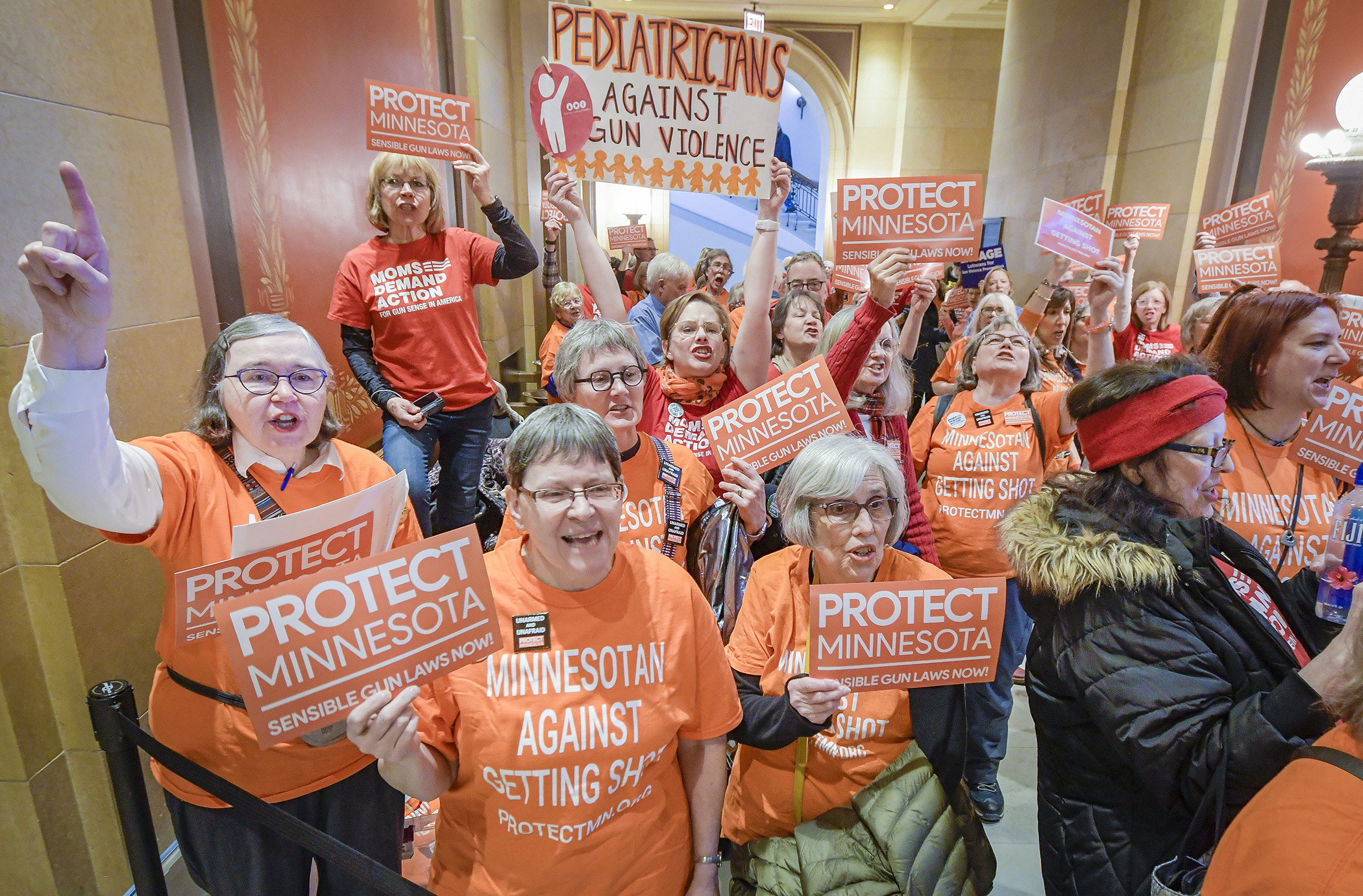 Gun safety advocates Moms Demand Action and Protect Minnesota rally in front of the House Chamber in anticipation of two gun bills scheduled to be heard on the House Floor Thursday. Photo by Andrew VonBank